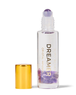 The Dreamer Perfume Roller by Bopo Women features a crystal infused essential oil blend to calm the mind, relax the body and support peaceful sleep.  A dreamy mix combining lemon, juniper berry and lavender essential oils. Perfect as a light natural perfume alternative. Features a Dream Amethyst rollerball.  * Natural, handcrafted, vegan  * Cruelty Free  * Designed and Made in Australia by Bopo Women