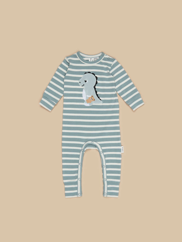 The Dino Stripe Romper by Huxbaby is made from the softest, premium organic cotton jersey in slate stripes! Featuring long sleeves to keep your little one toasty and warm.  Unisex design Stainless steel snaps at shoulder and crotch opening Made from gots certified organic cotton Sustainably produced Safe azo free dyes Cold gentle machine washable Packaged in a 100% recycled LDPE bag Designed in Melbourne, Australia by Huxbaby