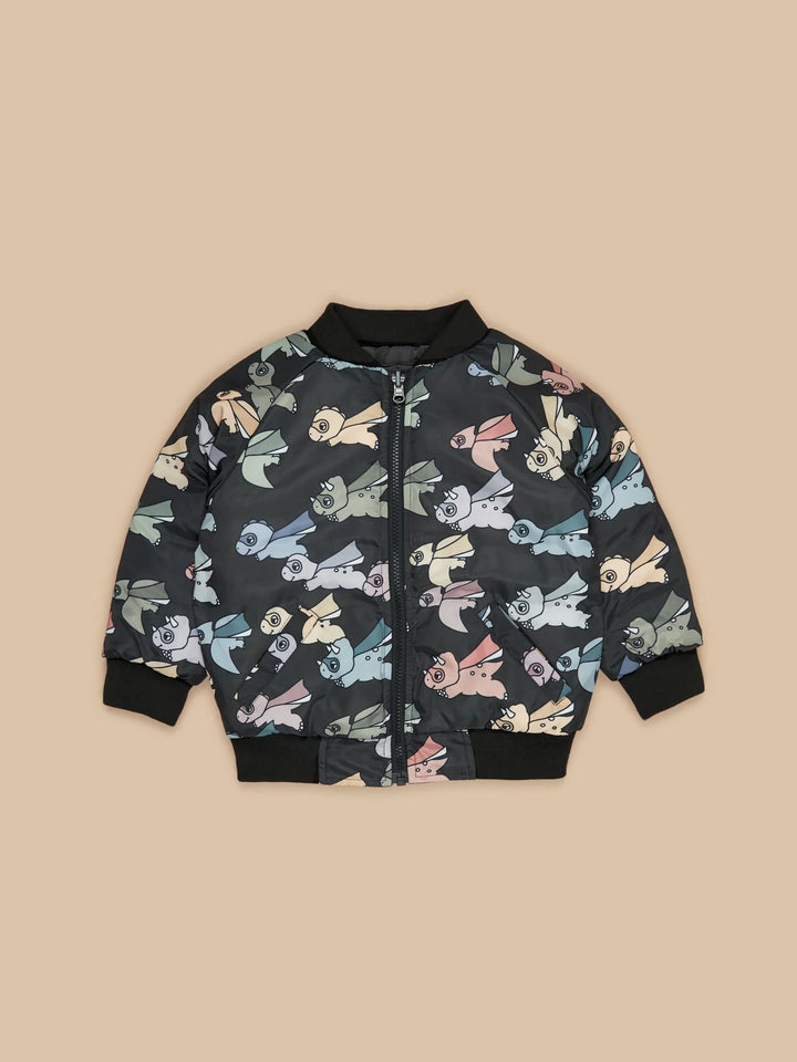 2-in-1 equals double the fun with the Super Dino Reversible Bomber by Huxbaby!   Turn this reversible bomber inside out to reveal an all-over super dino print on one side and solid black tone on the reverse to match any outfit!   2 jackets in 1 style Showerproof on both sides Sustainably produced Made from gots certified organic cotton Safe azo free dyes Cold gentle machine washable Designed in Melbourne, Australia by Huxbaby