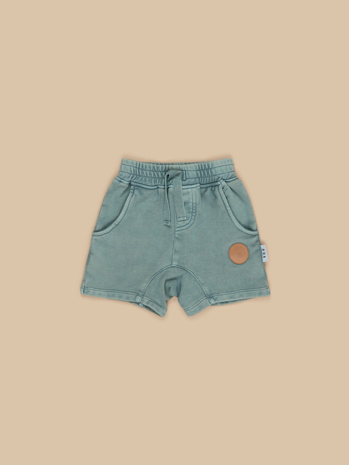 Get that cool vintage vibe with these washed-look Vintage Slate Slouch Shorts for all-day comfort.  Designed by Huxbaby, they are made from super soft, premium GOTS certified organic cotton and have a great worn vintage look.  Features soft elasticised waistband and pockets on each side and back Sustainably produced Safe azo free dyes. Designed to fade over time/ Cold gentle machine washable separately Packaged in a 100% recycled LDPE bag Designed in Melbourne, Australia by Huxbaby