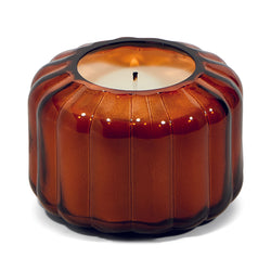 The Tobacco Patchouli Small Ribbed Glass Candle by Paddywax is designed to elevate tablescapes.   Bring a vintage touch to your next dinner party with these subtle and finely ribbed coloured glass vessels, available in both small and large sizes.  With a focus on sustainability, a repurposing tip is to try using the vessel as a votive for tea lights.  Top Notes: Cinnamon, Nutmeg Middle Notes: Patchouli, Vetiver Base Notes: Tobacco, Sandalwood, Creamy Vanilla