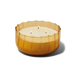 The Golden Ember Large Ribbed Glass Candle by Paddywax is designed to elevate tablescapes.   Bring a vintage touch to your next dinner party with these subtle and finely ribbed coloured glass vessels, available in both small and large sizes.  With a focus on sustainability, a repurposing tip is to try using the vessel as a votive for tea lights.  Top Notes: Cade Oil, Wood Middle Notes: Cade Oil, Spices, Musky Base Notes: Cedarwood, Vetyver, Woody