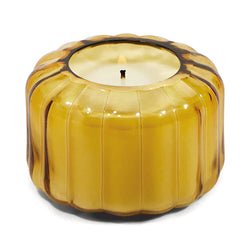 The Golden Ember Small Ribbed Glass Candle by Paddywax is designed to elevate tablescapes.   Bring a vintage touch to your next dinner party with these subtle and finely ribbed coloured glass vessels, available in both small and large sizes.  With a focus on sustainability, a repurposing tip is to try using the vessel as a votive for tea lights.  Top Notes: Cade Oil, Wood Middle Notes: Cade Oil, Spices, Musky Base Notes: Cedarwood, Vetyver, Woody