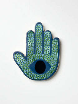 Looking for the perfect accent for your wall? Look no further than the Signal Blue Hand by Jones & Co.   Handmade from natural Capiz shell and adorned with playful polka dots, this design features an evil eye in the centre.  *Designed for indoor use  *Length: 10cm/ Width: 13cm/ Height: 1cm  *Designed in Sydney and hand-crafted in the Phillipines by Jones & Co artisans