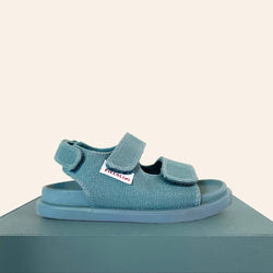 We are obsessed with the Blue OG Sandal by Piccolini, perfect for summer!  These Aussie-designed sandals are a collab by a footwear designer and a chiropractor, making them not only stylish but podiatrist-approved!   Features: Made out of premium certified organic cotton Podiatrist Recommended Soft moulded footbed Machine Washable Easy 3 velcro strap closure Genuine non-slip rubber sole Designed in Australia by Piccolini 
