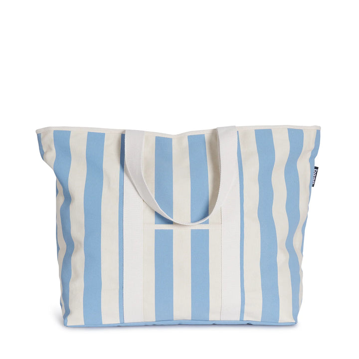 Classic carryall meets cabana cool with the Powder Blue Stripe All Day Bag by Base Supply. Crafted from sturdy cotton canvas with a quintessential summer stripe, it's practically perfect in every way.  *100% cotton canvas  *Soft shoulder straps  *Internal zip pocket + Front storage pocket  *Machine washable + Air-dry out of direct sunlight  *Measurements: W (top) 62cm & W (bottom) 45cm/ H 41cm/ D 18cm
