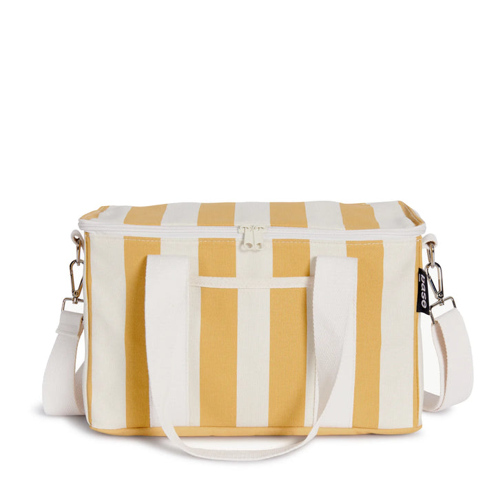 The Mustard Stripe Midi Cooler Bag by Base Supply is a great beach-friendly cool bag to hold snacks and drinks from sunrise to sunset.  *Insulated on the inside  *Made from durable cotton canvas  *Zip top closure + external pocket for small essentials  *Soft cotton handle + detachable shoulder strap  *Wipe clean inner and outer + air-dry completely before storing  *Measurements: W 33cm/ H 20cm/ D 18cm  *Designed by Base Supply in Melbourne