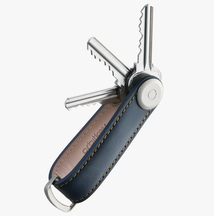 The answer to your pocket jingling woes is the Navy Leather Orbitkey Organiser! 