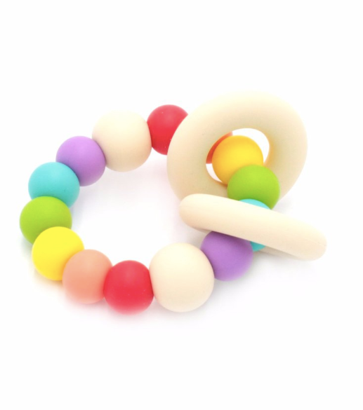 Ease your bubs teething with these Trio Teethers in Rainbow!  Designed by Lluie in Melbourne, Australia; the TRIO teether features 2 silicone donut rings which circulate the larger beaded silicone ring.