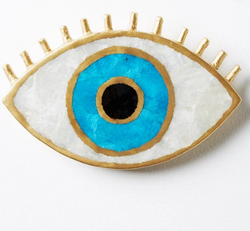 Looking for the perfect accent for your wall? Look no further than the evil eye wall art by Jones & Co. 