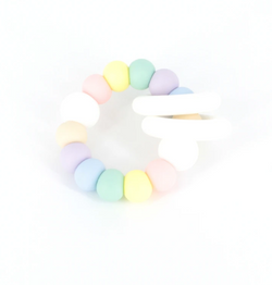 Ease your bubs teething with the Trio Teether- pastel rainbow by Lluie!  The TRIO teether features 2 silicone donut rings which circulate the larger beaded silicone ring