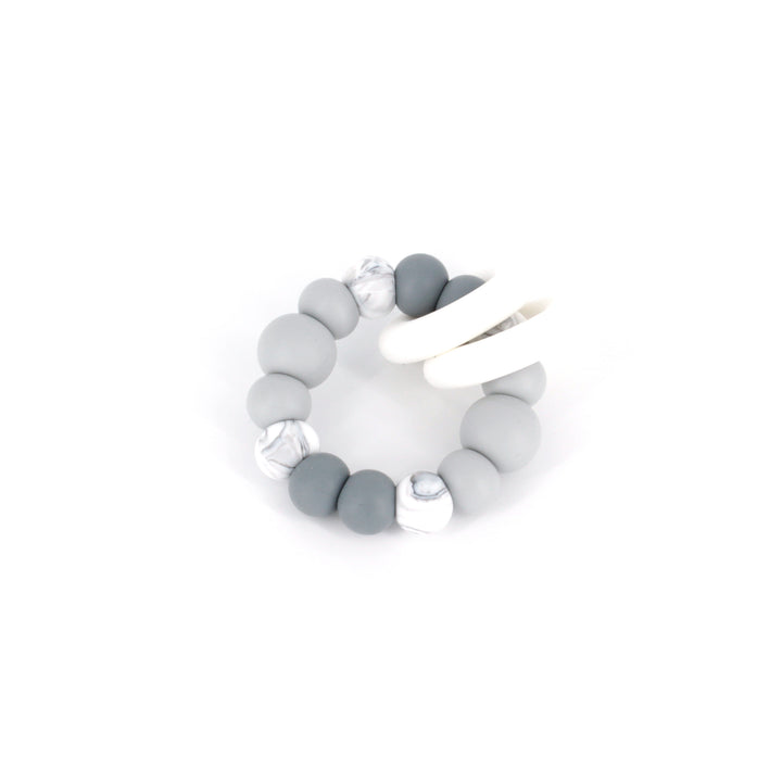 Ease your bubs teething with these Trio Teethers in Grey Ombre!  Designed by Lluie in Melbourne, Australia; the TRIO teether features 2 silicone donut rings which circulate the larger beaded silicone ring.