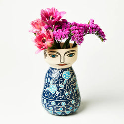 Hand-crafted from earthenware clay, With a flower behind her ear and a patterned caftan on her bod, Luni is all about the coastal vibe.  She Looks amazing when complemented with flowers. 