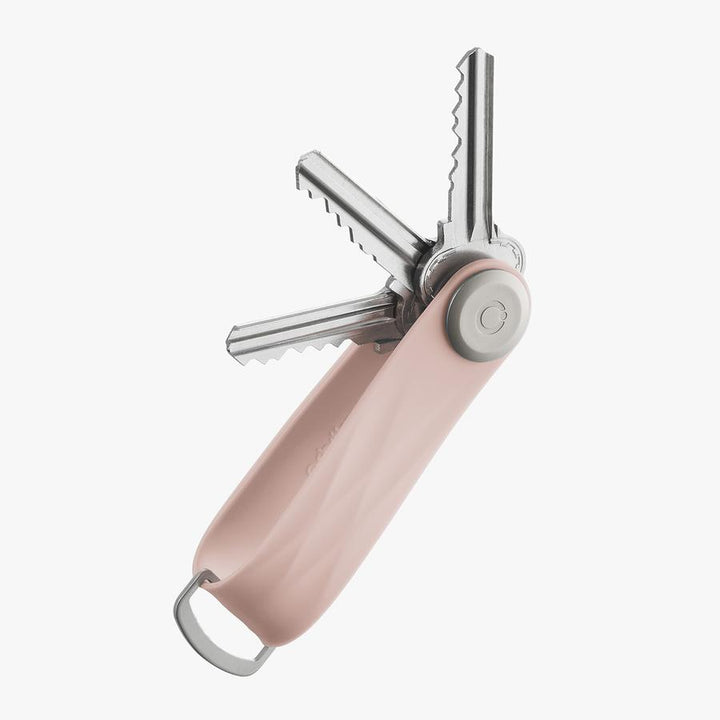 The answer to your pocket jingling woes is the Dusty Pink Active Orbitkey!